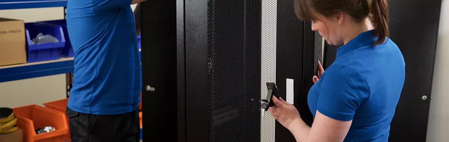 Woman and man building an indoor cabinet