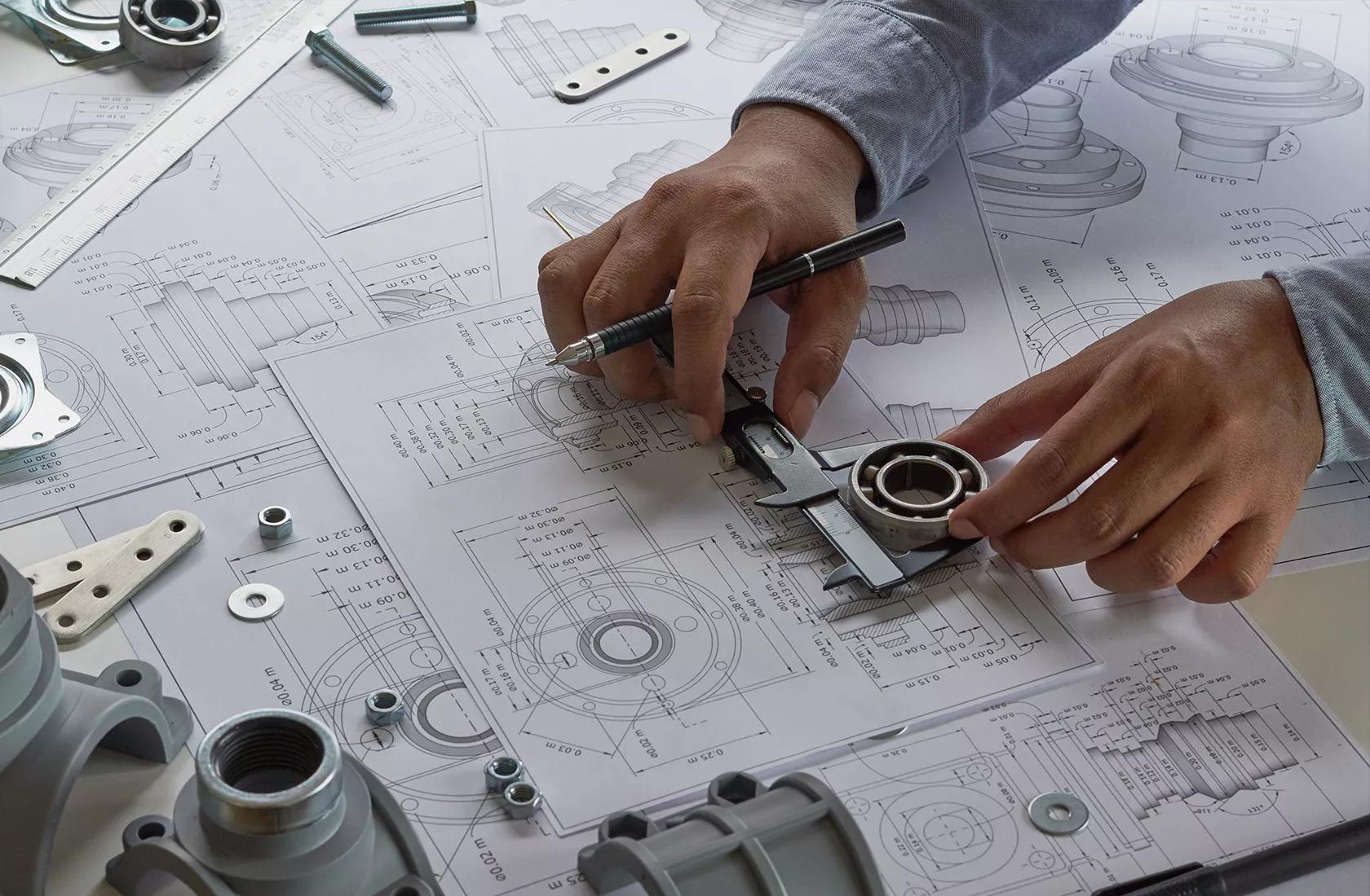 Engineer drawing technical designs