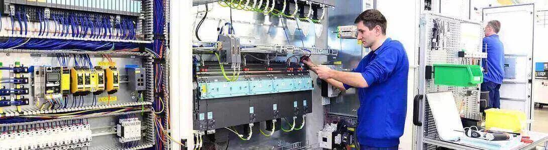 Factory operator installing cable protection in an electrical application