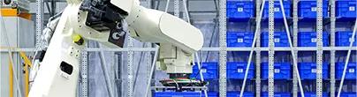 Smart logistics shown with an industrial robotic working in a factory warehouse
