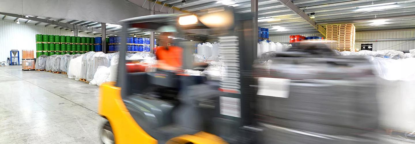 Warehouse forklift truck in transit 