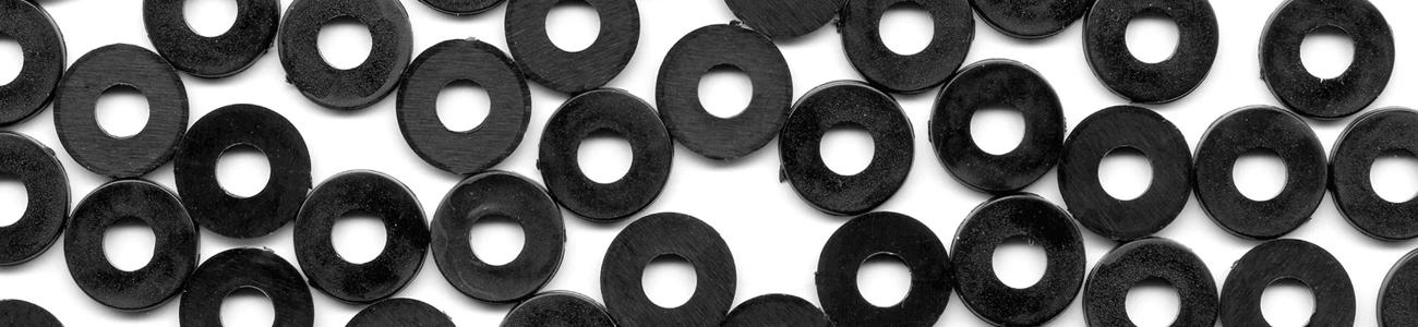 Lots of black protective washers for fasteners