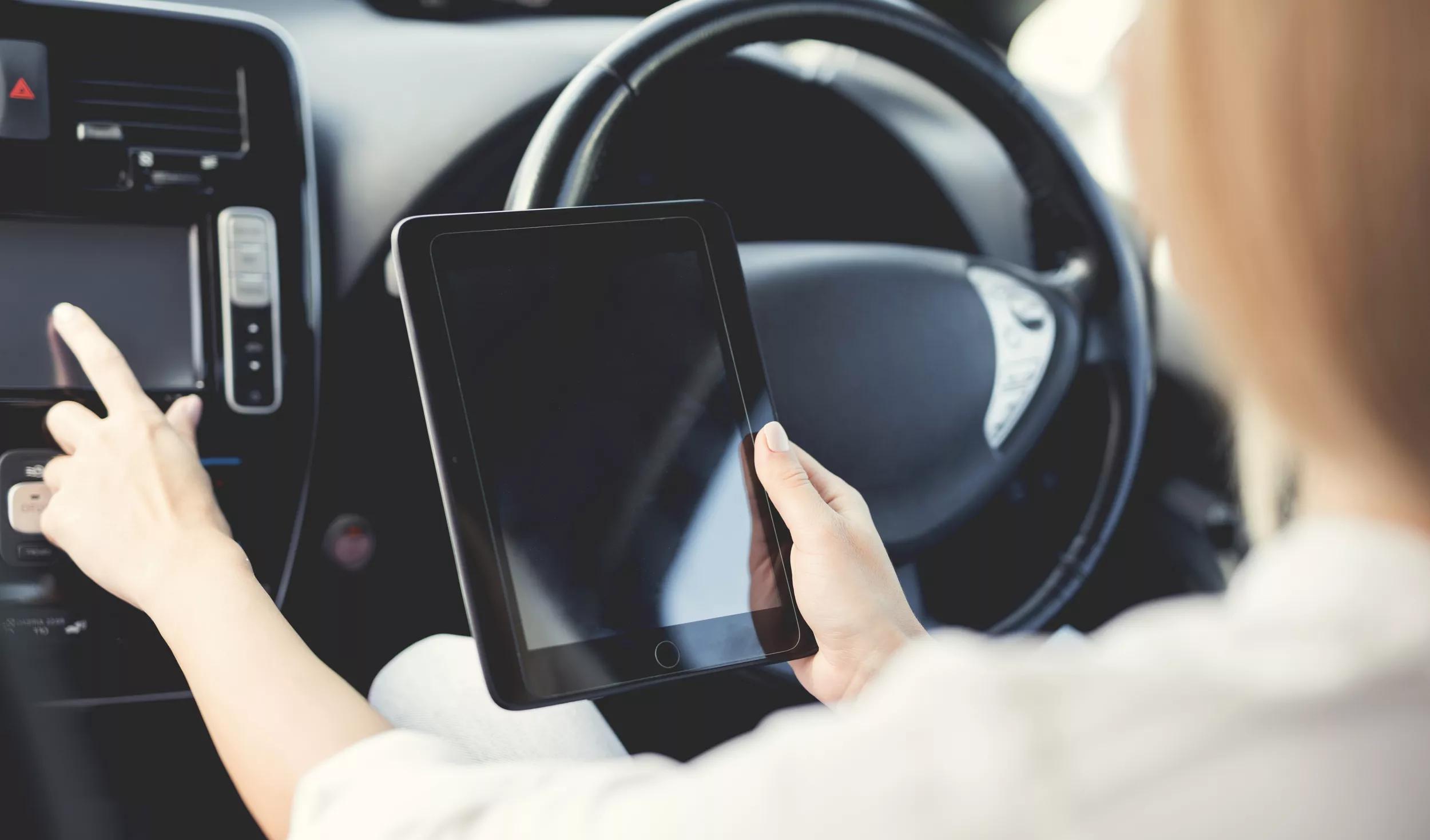 Lady pressing buttons on electric vehicle control devices