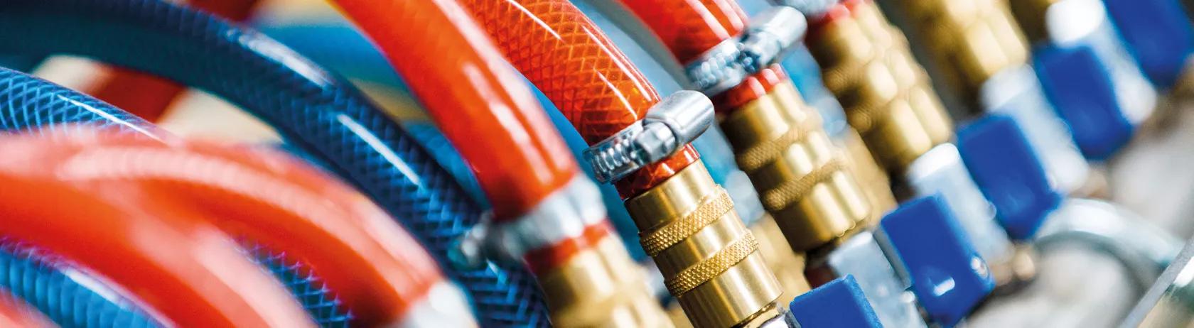 red and blue hydraulic hoses with fittings 