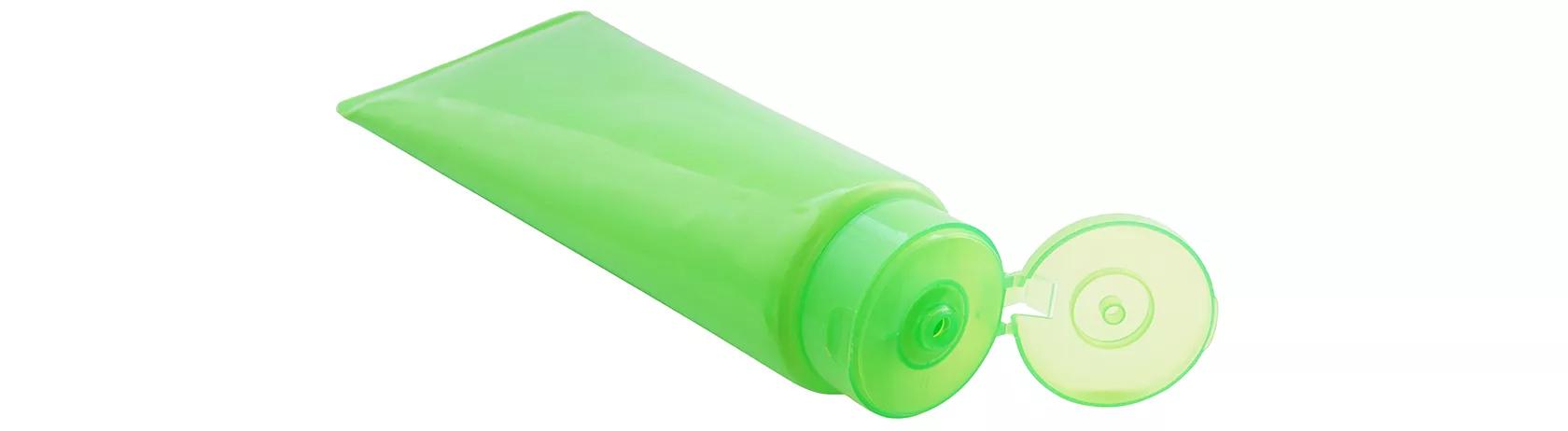 Green plastic tube with open living hinge lid
