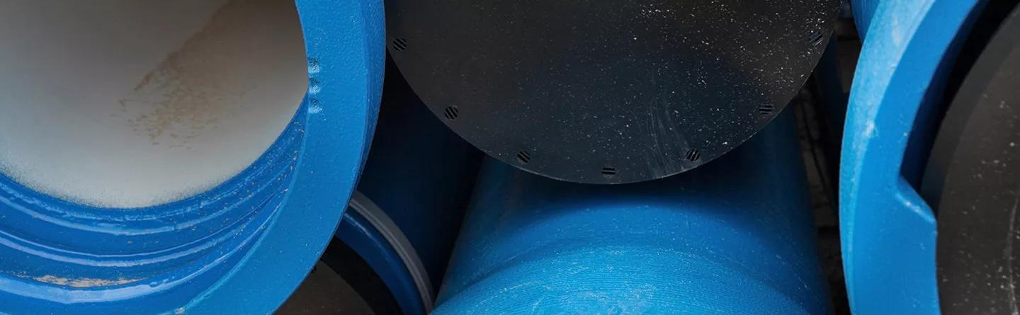Black cap on blue pipe