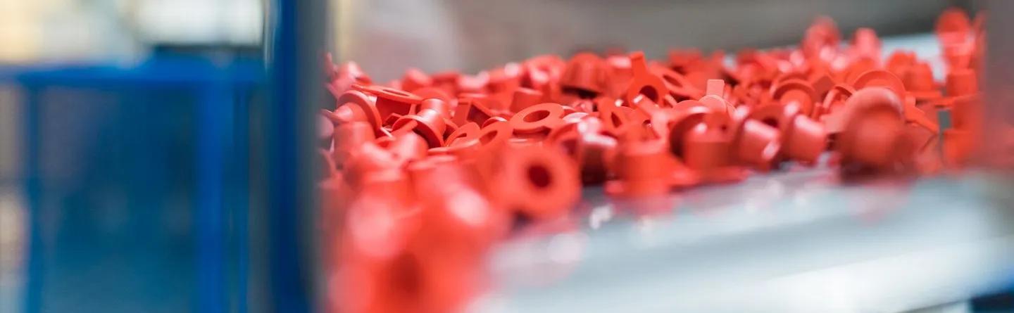 Red caps on injection moulding machine