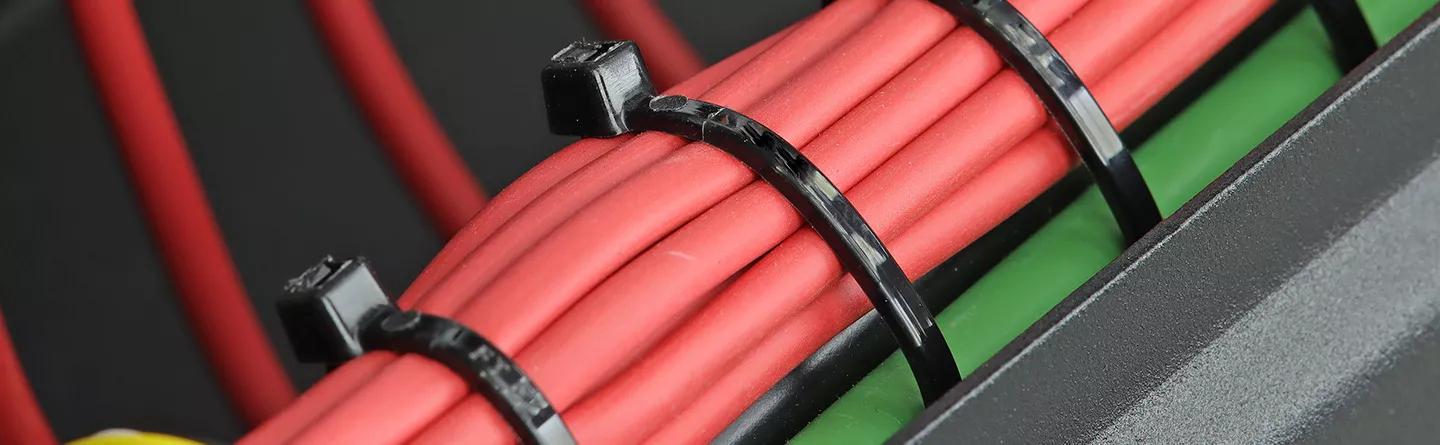 Cable ties on red cables