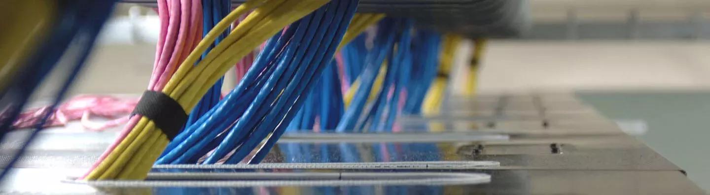 Colourful cables managed with protective tubing