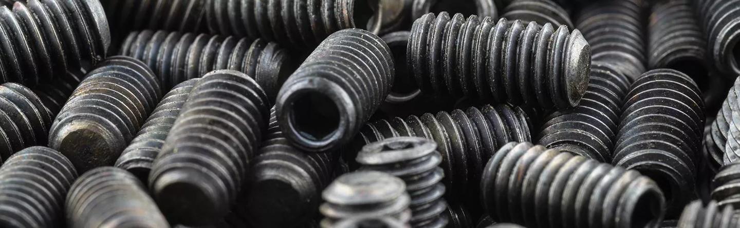 Pile of black set screws
