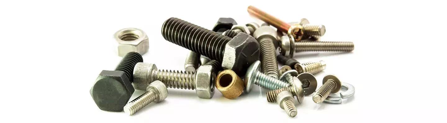 Pile of metal and plastic screws and fasteners
