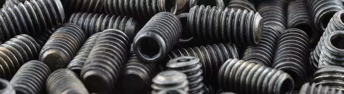 Pile of black set screws