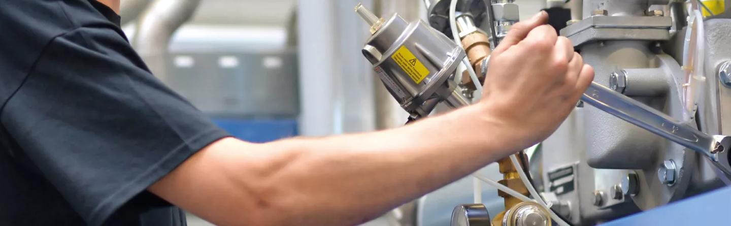 engineer working with a fluid power machine 